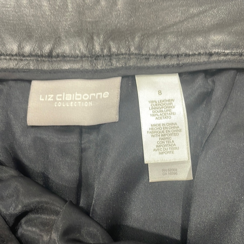 100% leather black pants, worn a couple of times. Small blemish near zipper.